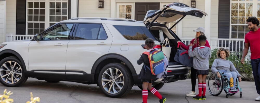 Parked Ford Explorer with Family