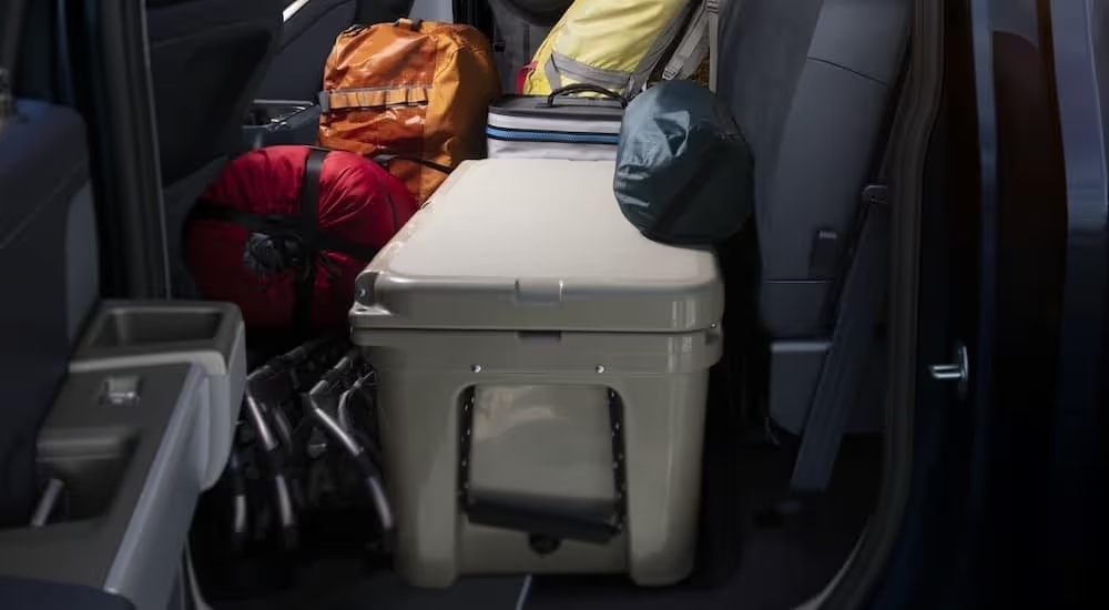 The rear cargo seating area is shown in a 2024 Ford F-150 Tremor.