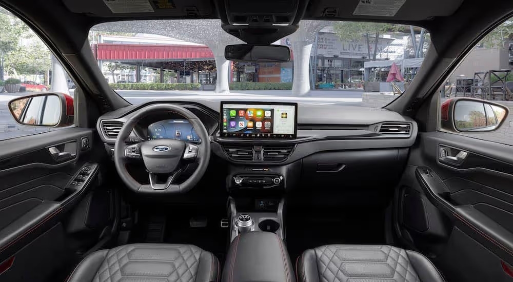 The black interior of a 2023 Ford Escape ST Line is shown from above the center console.