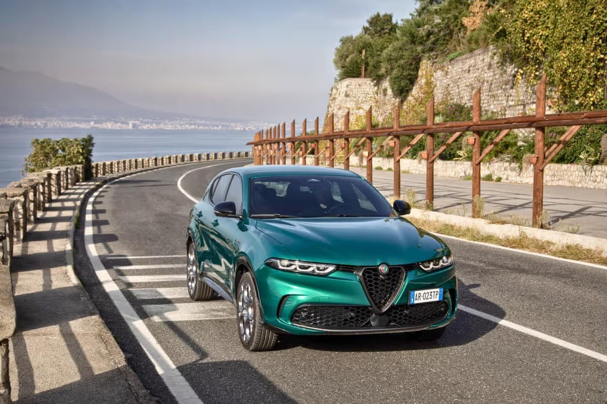 A sleek Alfa Romeo Tonale PHEV SUV parked against a scenic Italian backdrop, showcasing its elegant design and sporty features.