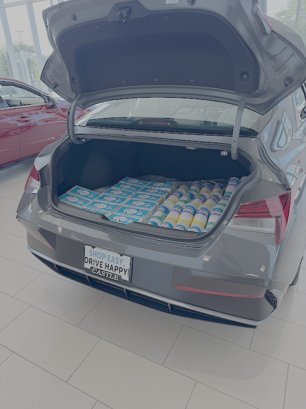 Vehicle trunk filled with school supplies for the Castle Cares Back to School Pit Stop