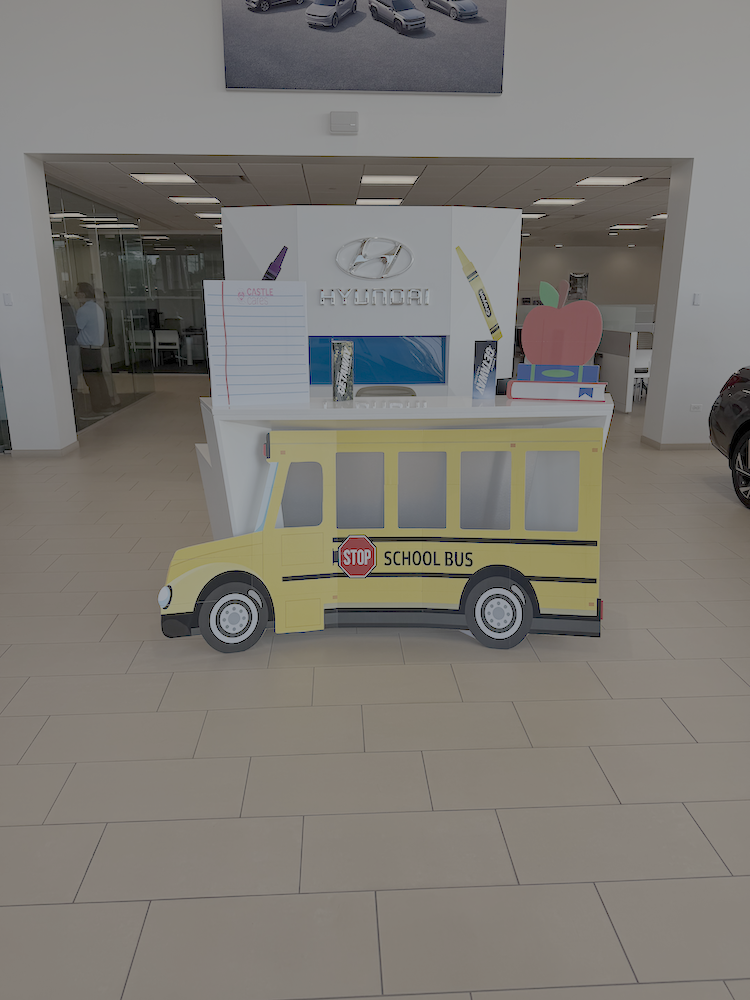 Castle Cares school bus display for the Back to School Pit Stop in Downers Grove