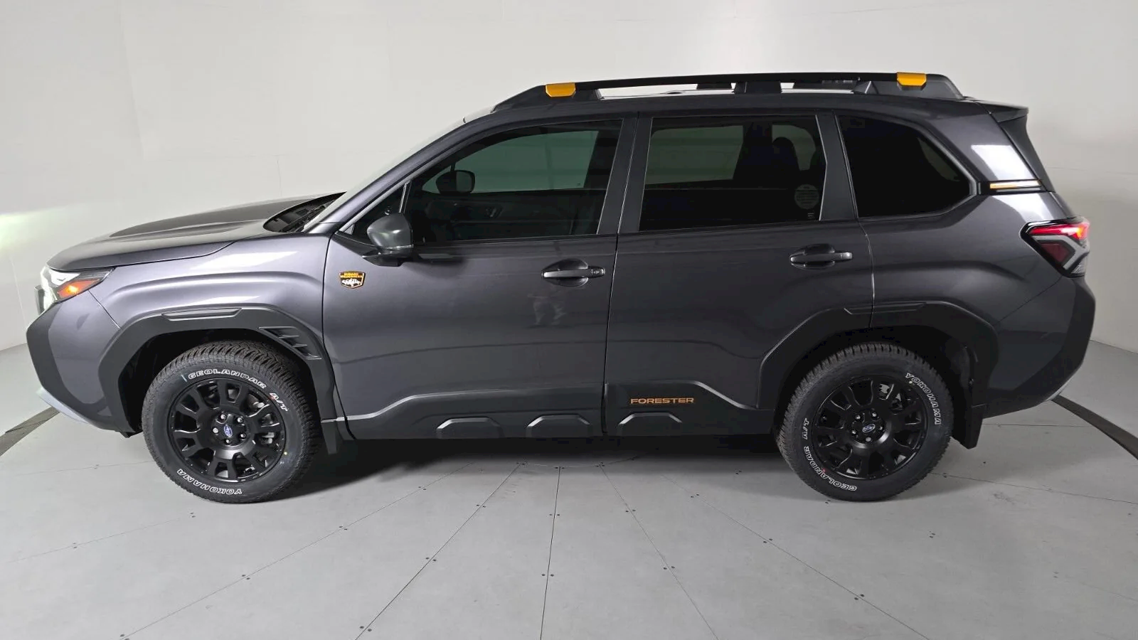 2026 Subaru Forester Wilderness at Findlay Subaru Prescott, driver-side profile showing the Geolandar A/T tires and black wheels (photo 1 of 9)