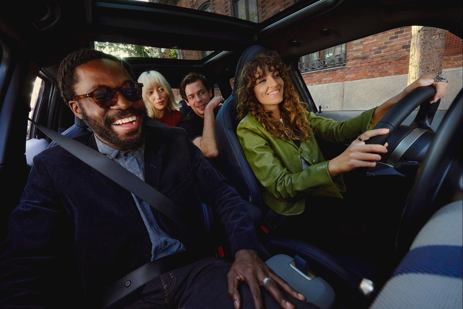 Friends riding together in a MINI in the city near Darien, Connecticut