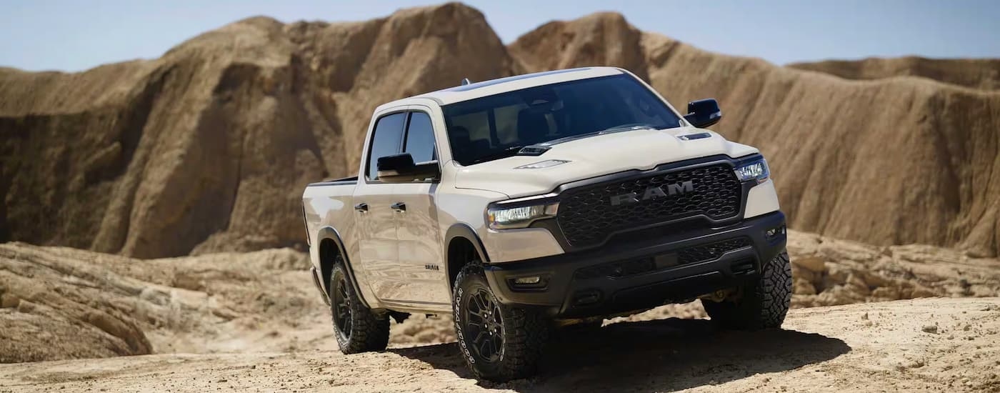 White 2026 Ram 1500 driving off-road.