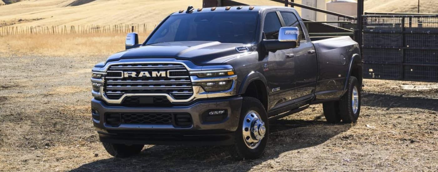Black 2026 Ram 3500 driving off-road.