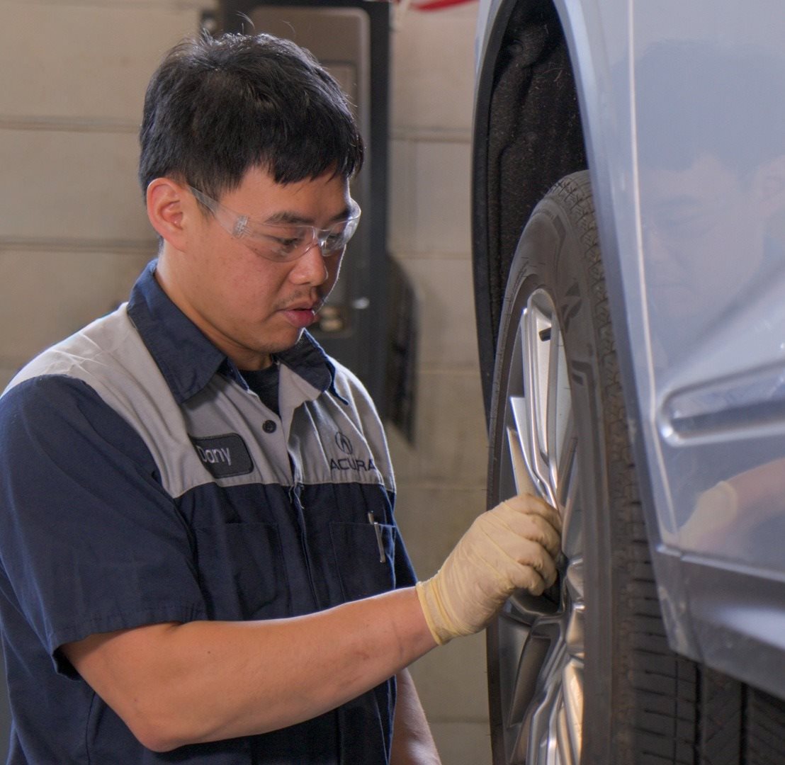 Service Tech Under Car Hood