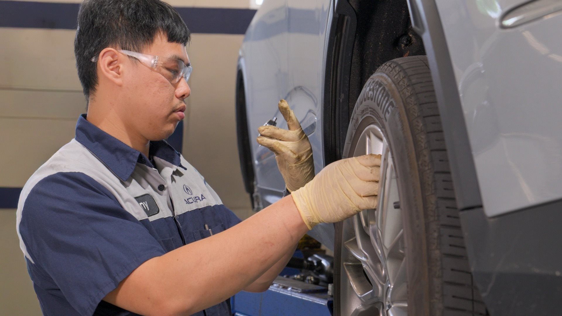 Service Tech Under Car Hood