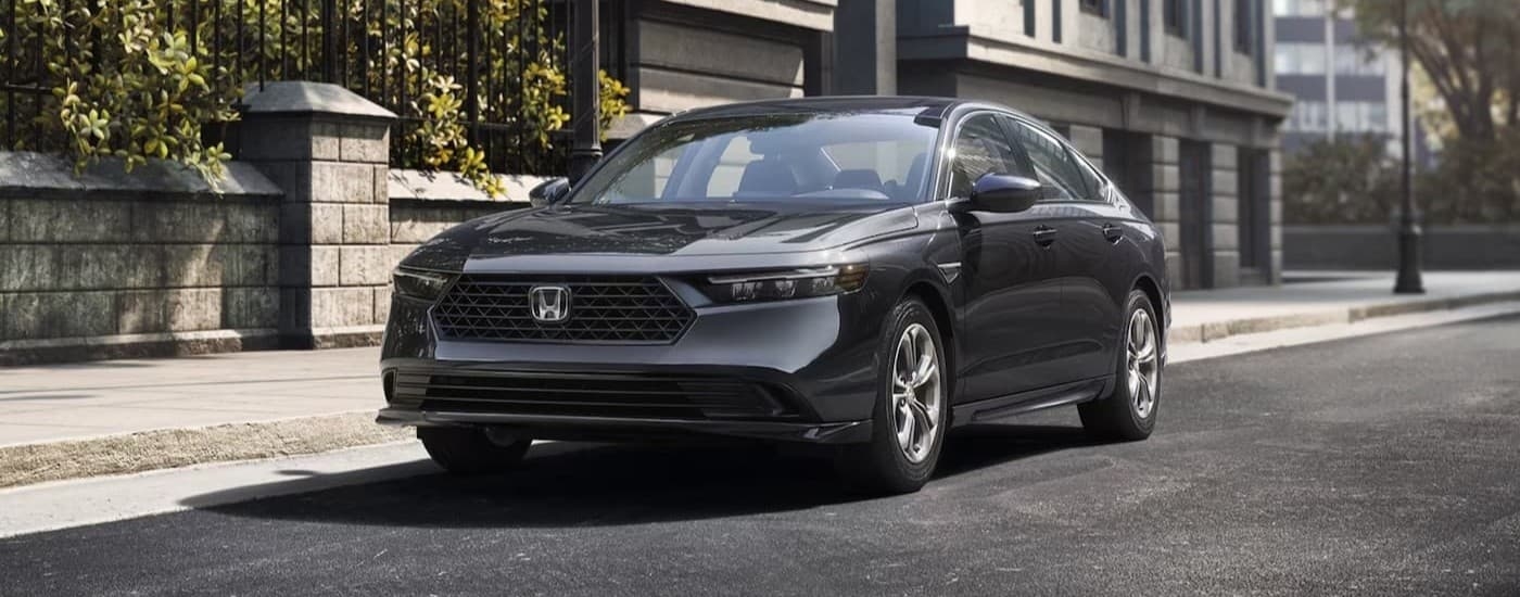 A gray 2026 Honda Accord parked in a city.