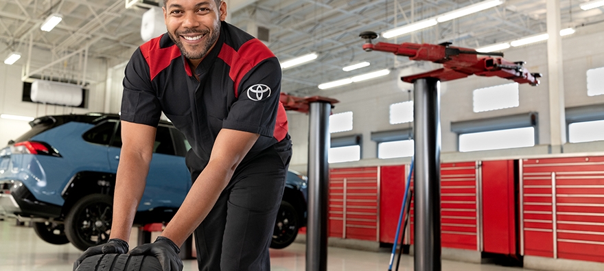 Toyota mechanic changing tire
