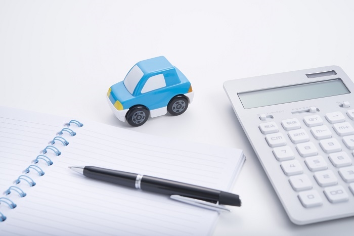 Subaru financing materials including toy car and calculator