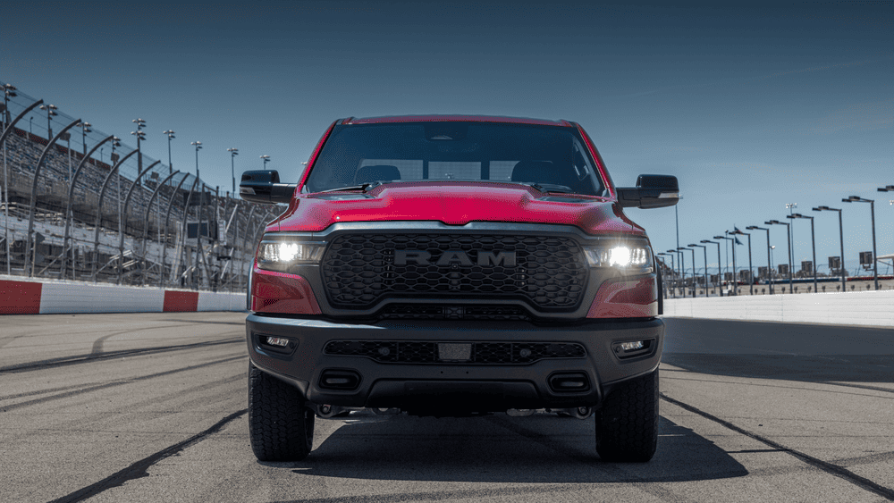 2026 Ram 1500 Rebel HEMI V8 in red with blacked-out RAM grille and LED headlights in Margate FL