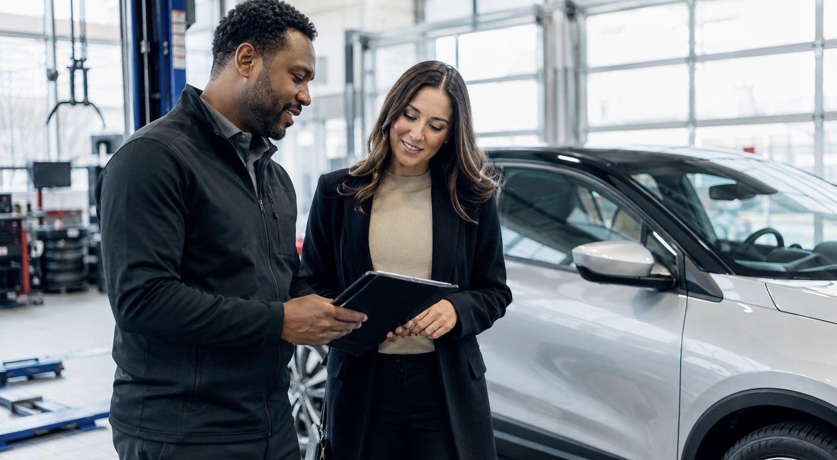 Toyota service advisor reviewing a maintenance schedule checklist with a customer at Toyota of Downtown Chicago