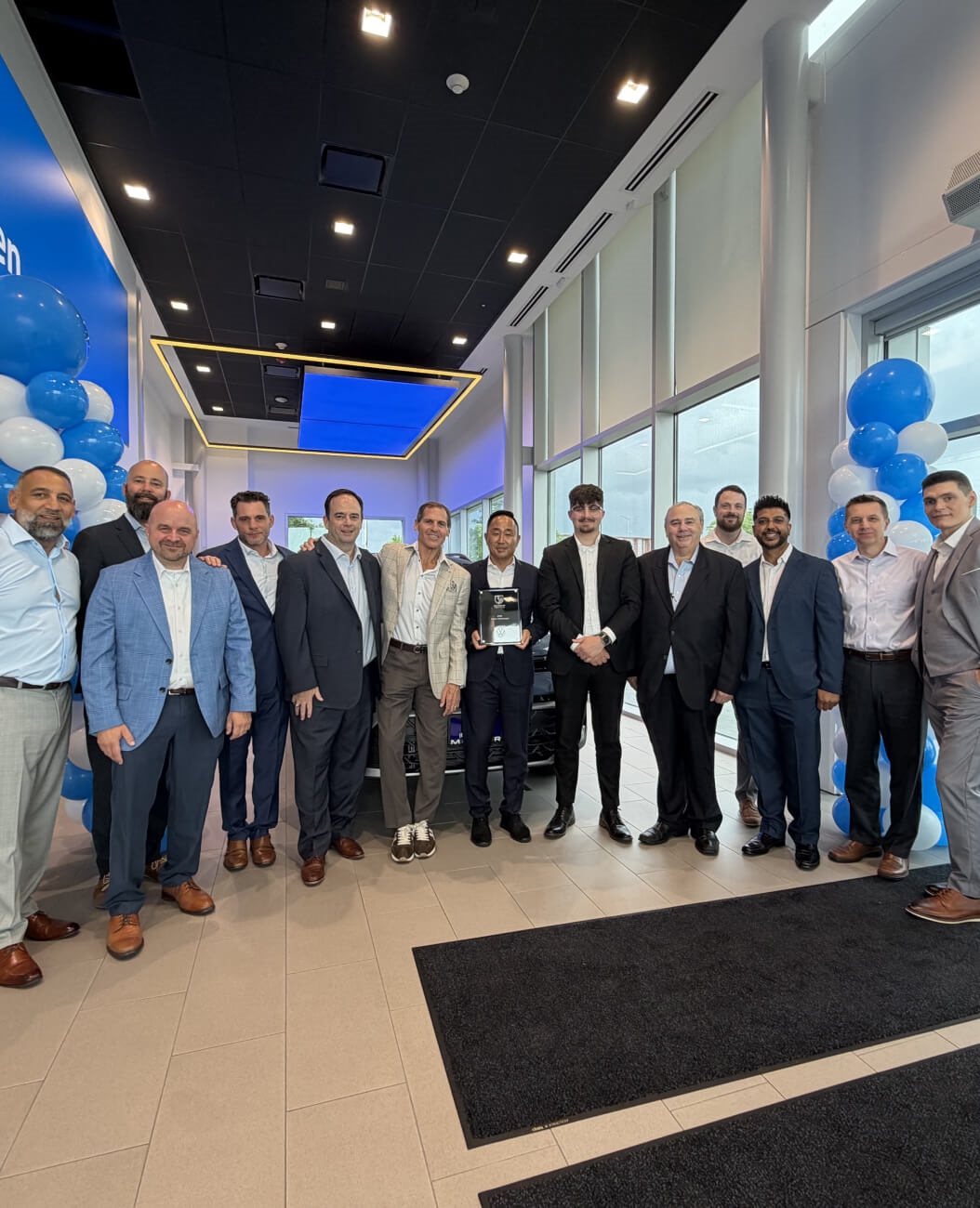 Muller Volkswagen team poses with the 2025 Wolfsburg Crest Club Award.
