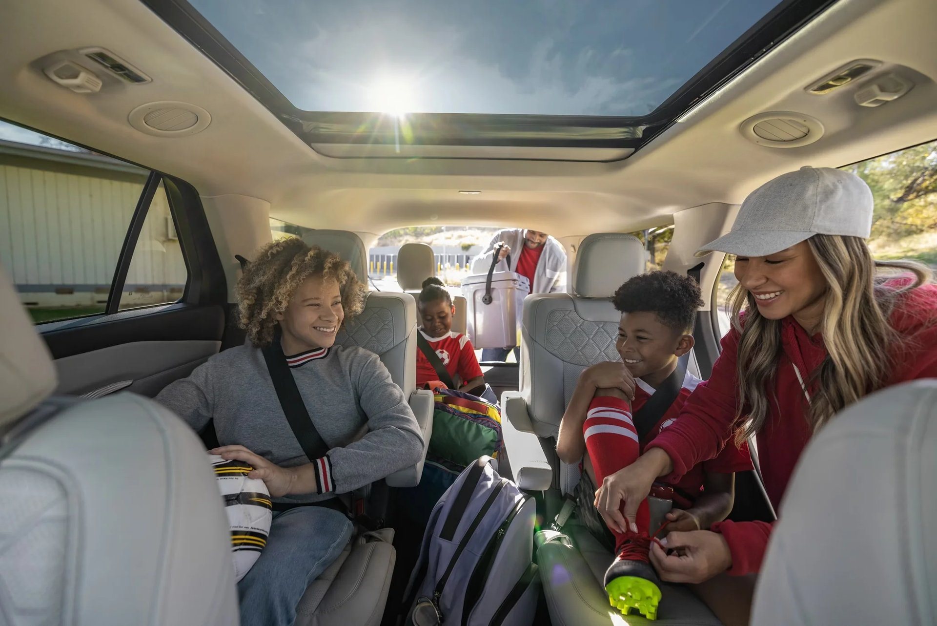 Children seated in the rear of a Ford Explorer, the three-row layout used Explorer shoppers are buying for