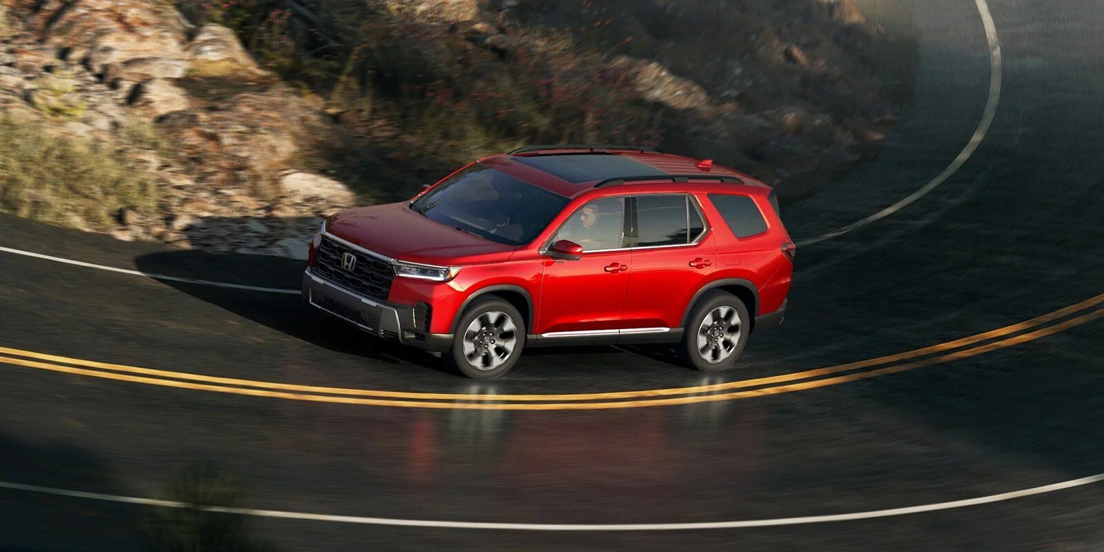 2026 Honda Pilot on a two-lane road, the kind of drive Murfreesboro buyers make on I-24