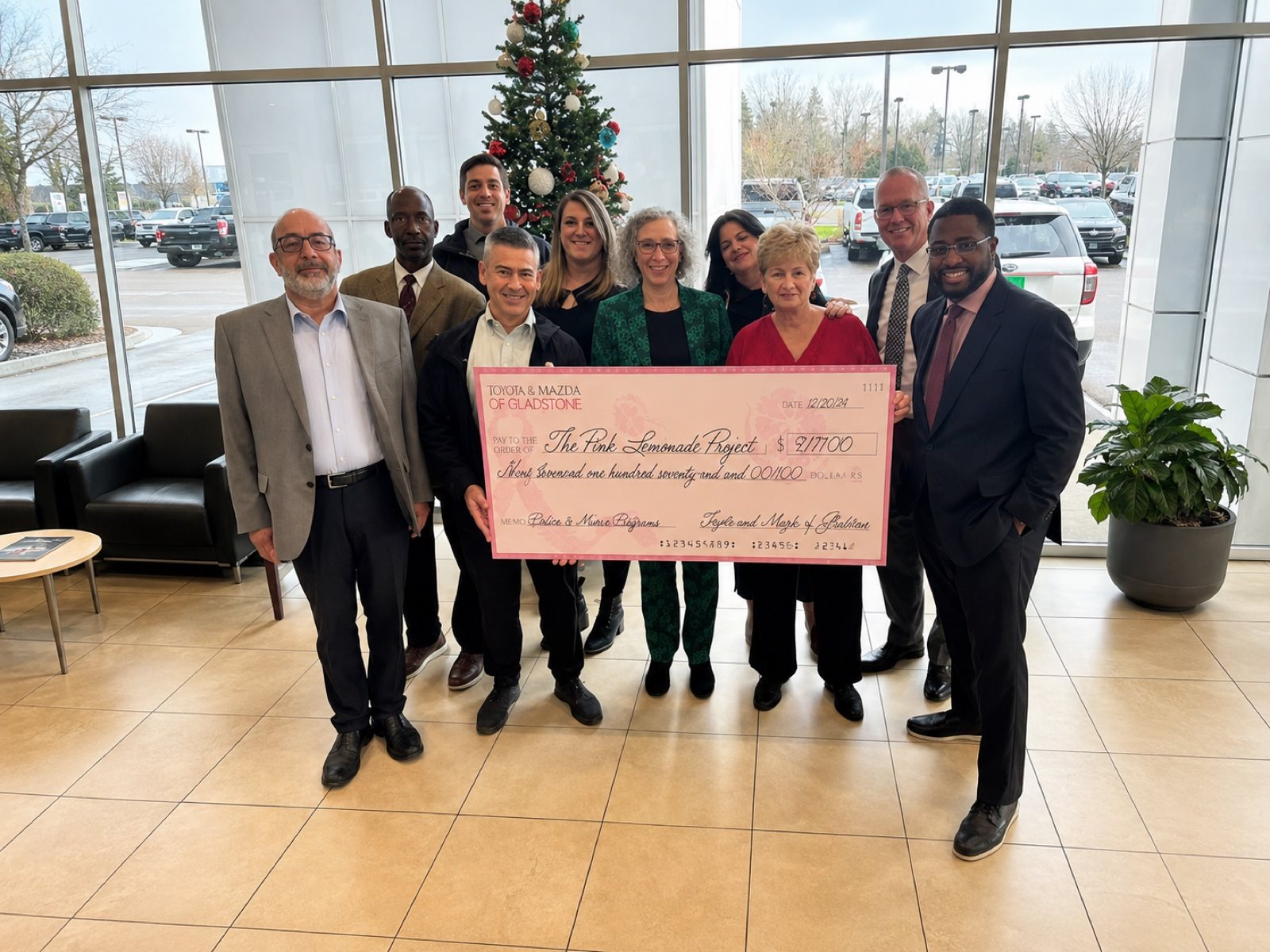 Toyota of Gladstone team presenting a donation check to the Pink Lemonade Project