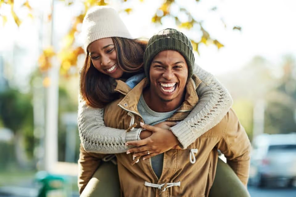 Portrait of a young attractive couple in a public park outside