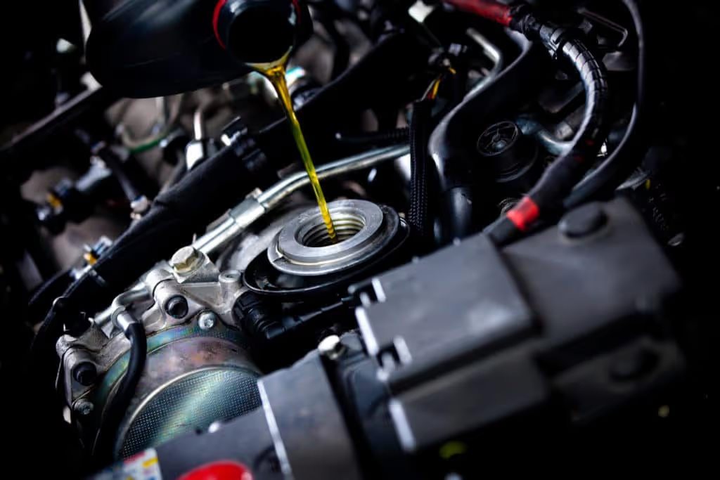 oil poured under hood of car