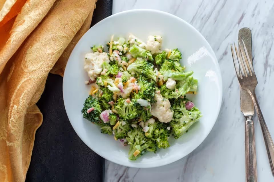 Broccoli and cauliflower bound salad with mayonnaise dressing