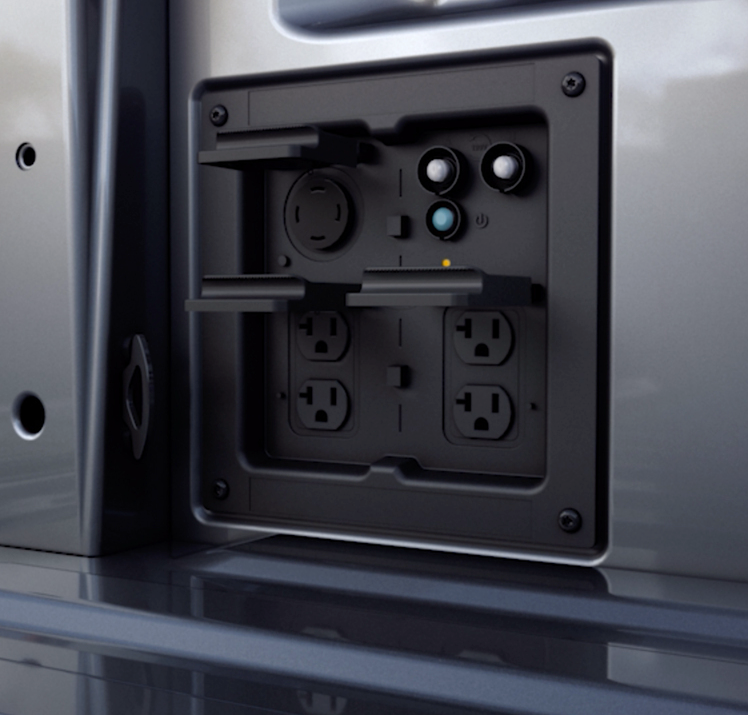 A Ford Pro Power Onboard outlet panel in the bed of a pickup truck.