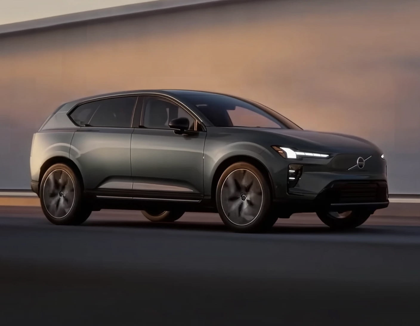 Gray Volvo EX60 shown driving from a front three-quarter angle.