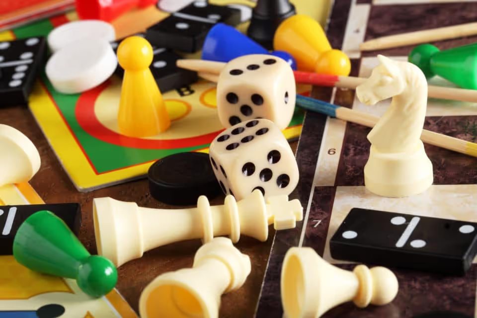 Board games, pawns, chessmen, dominoes and dices.