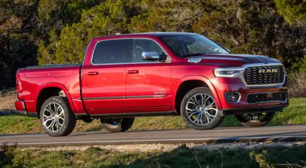 Red 2026 Ram 1500 driving off-road.