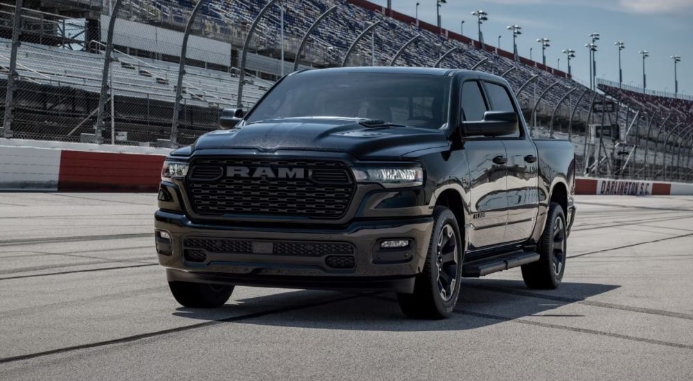 Black 2026 Ram 1500 Black Express on a racetrack.