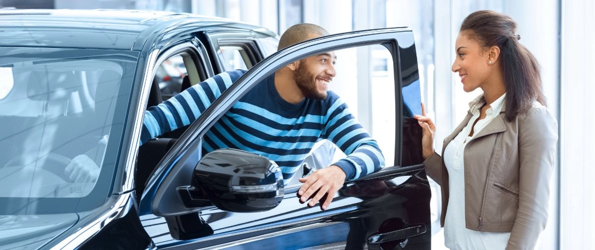 Customers Looking at Car