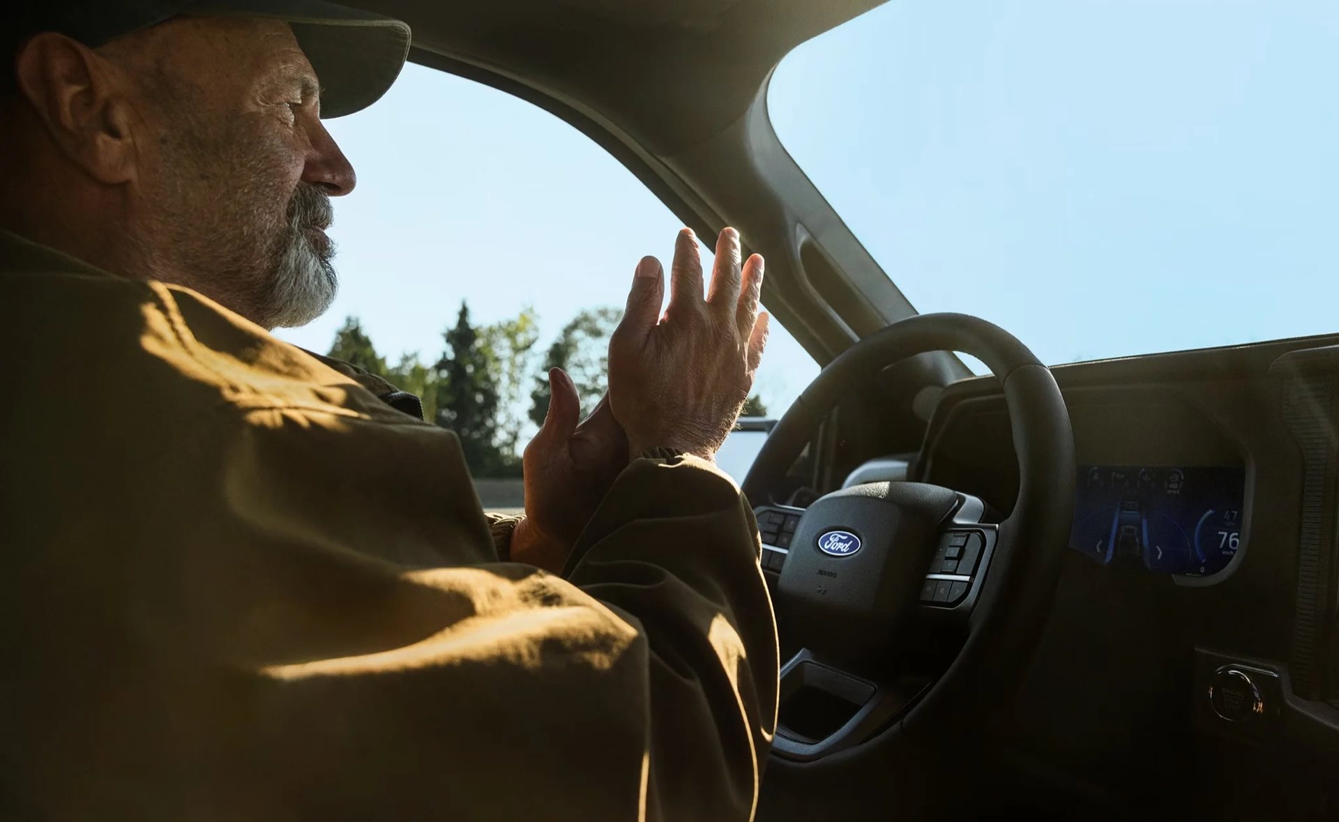 A driver using BlueCruise hands-free highway driving in a 2026 Ford F-150