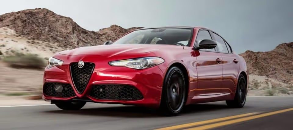 A red Giulia on a road