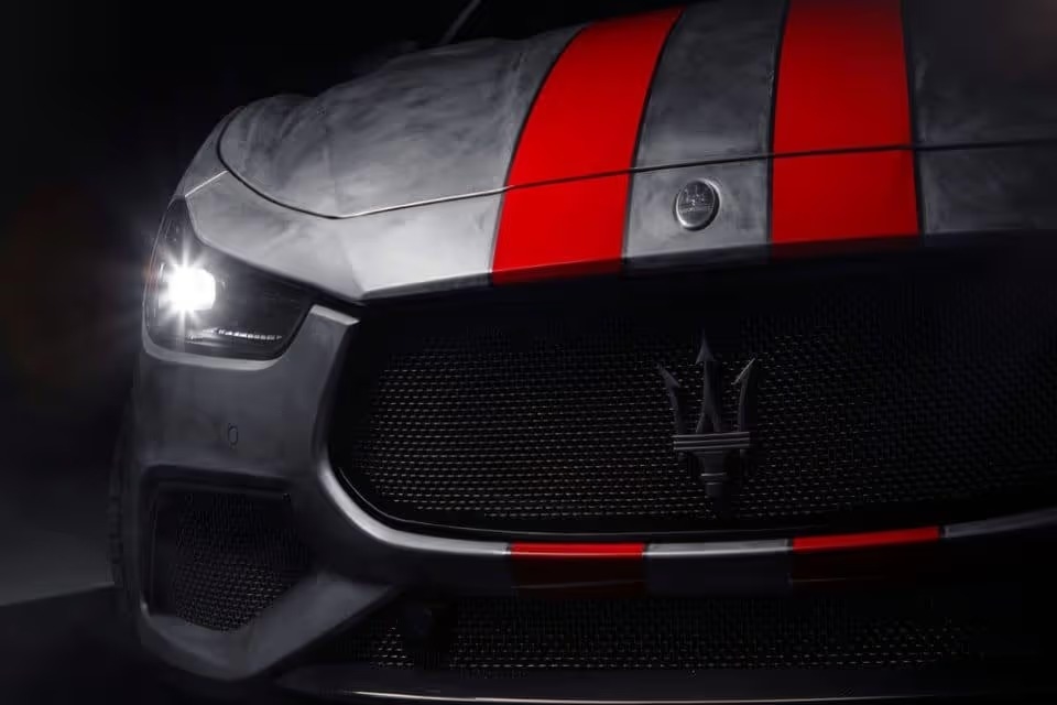 The 2020 Maserati Fuoriserie Corse. It has gray paint with two red racing stripes on the hood. 