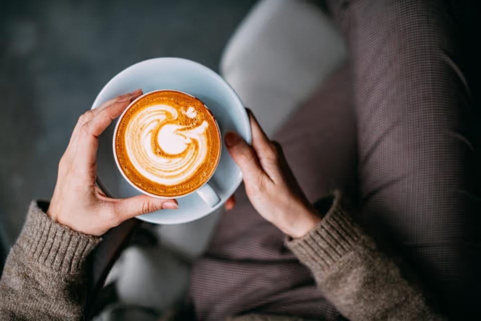 Woman holding a cup of coffee