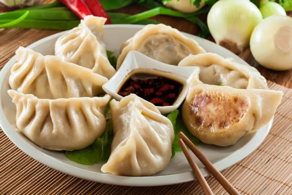 dumplings with pork meat and vegetables on a plate