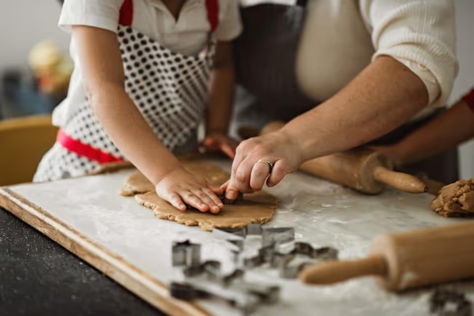 Family making christmas ginger cookies