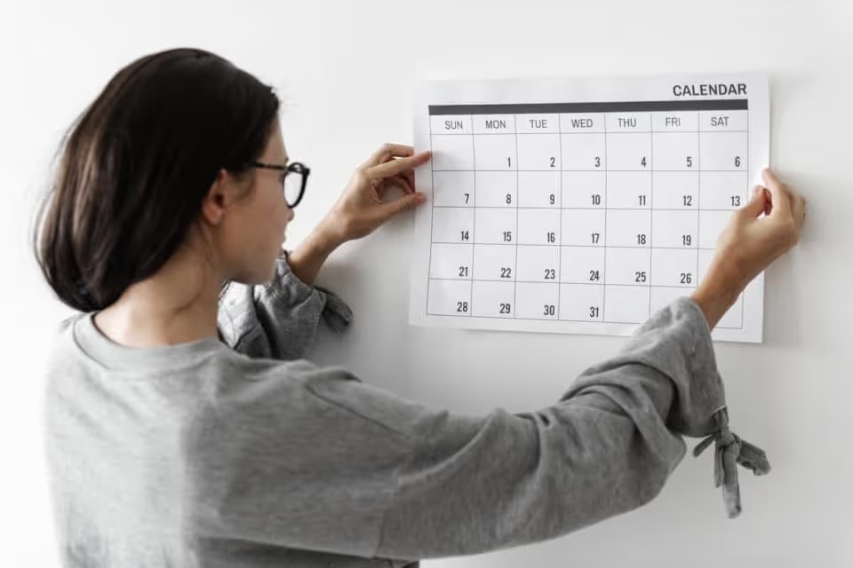 Woman checking the empty calendar