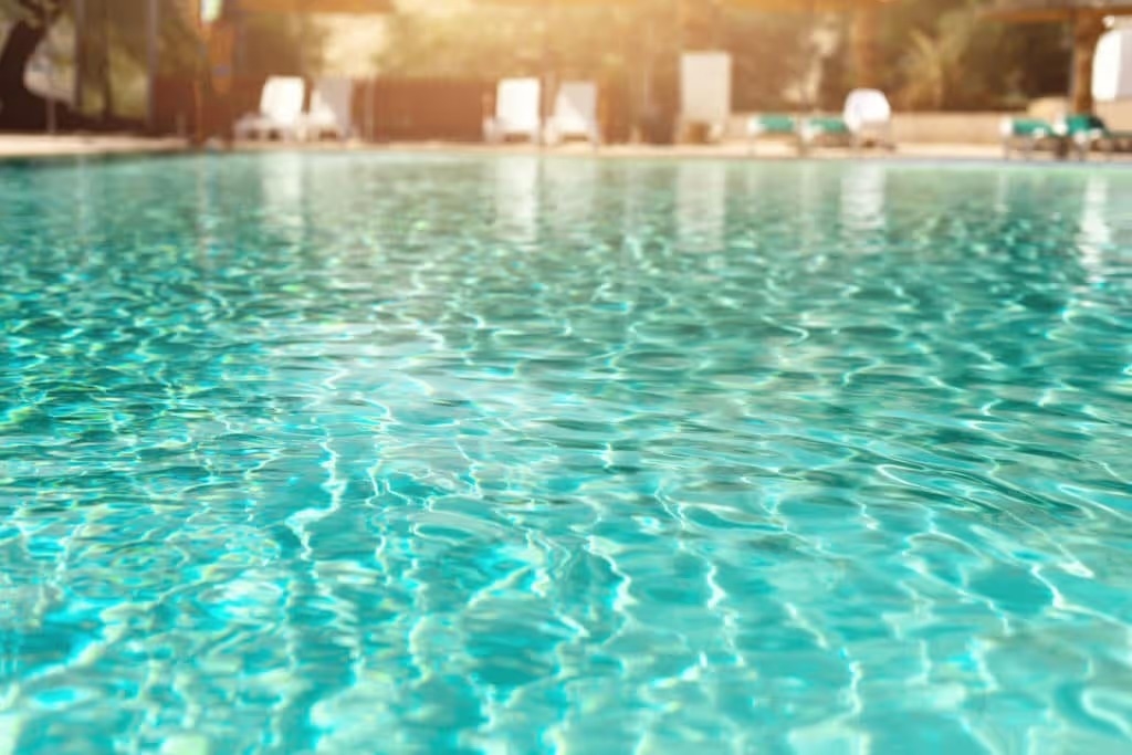 surface of water in pool with light refractions