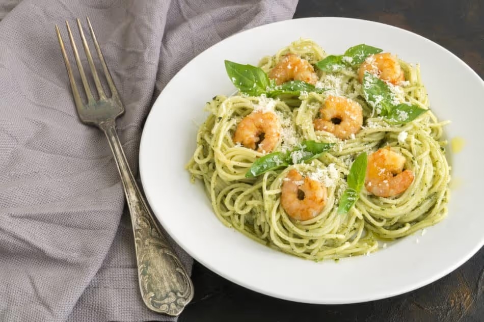traditional Italian dish. pasta with pesto and shrimp