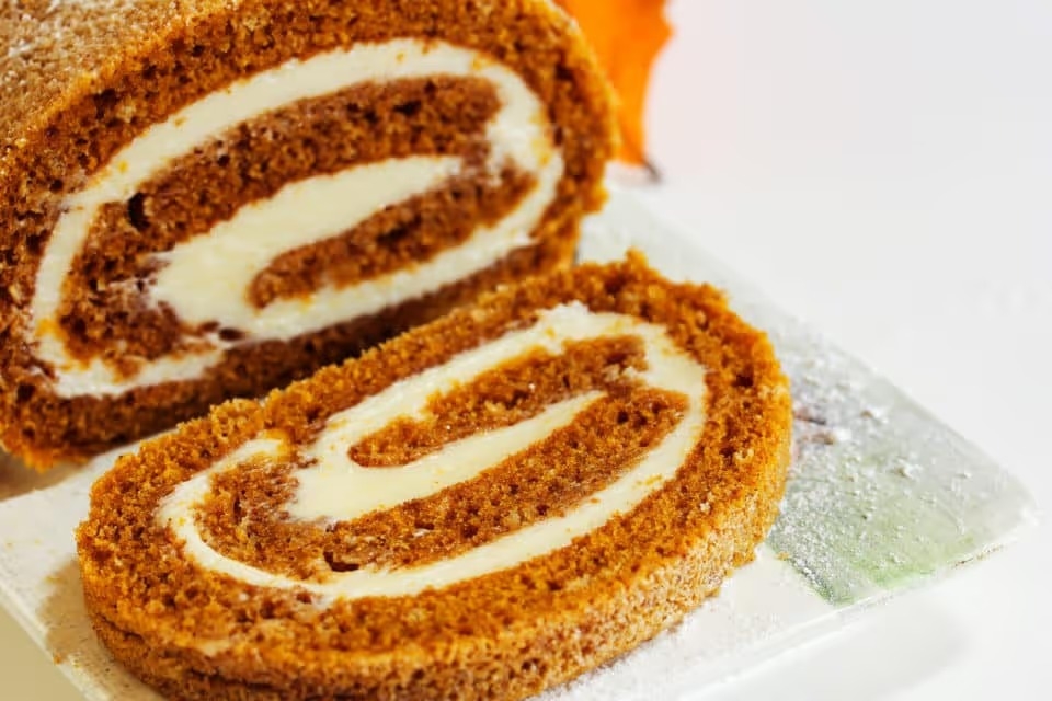 Pumpkin Roll with white icing for thanksgiving autumn food