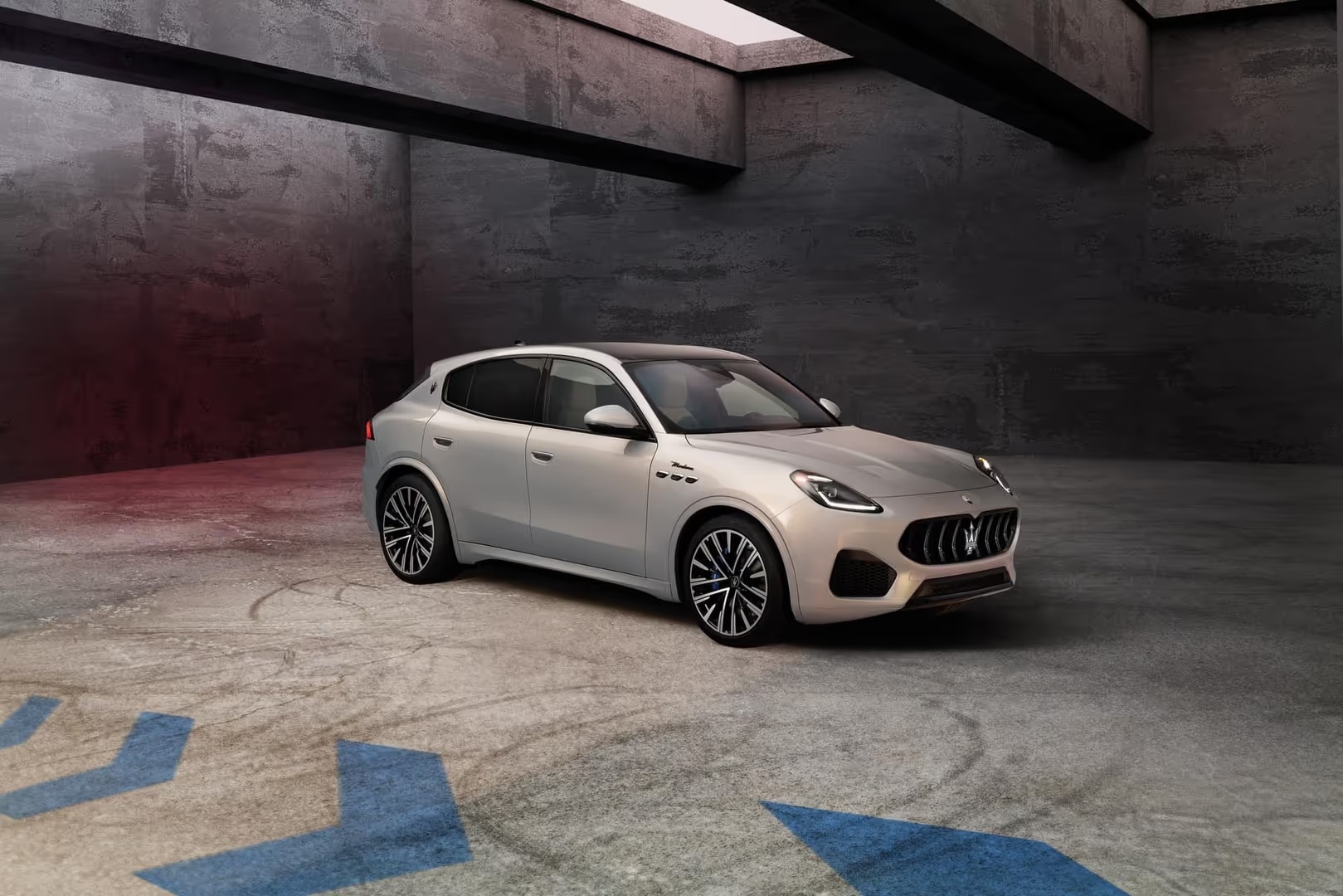 A new Maserati Grecale SUV parked elegantly in a spacious garage, showcasing its sleek design and luxury features.