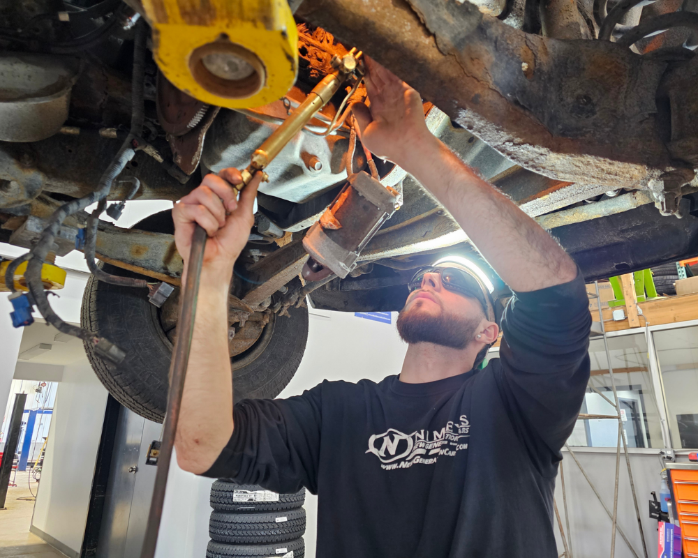 ASE-certified technician servicing a vehicle at New Generation Cars in Utica NY
