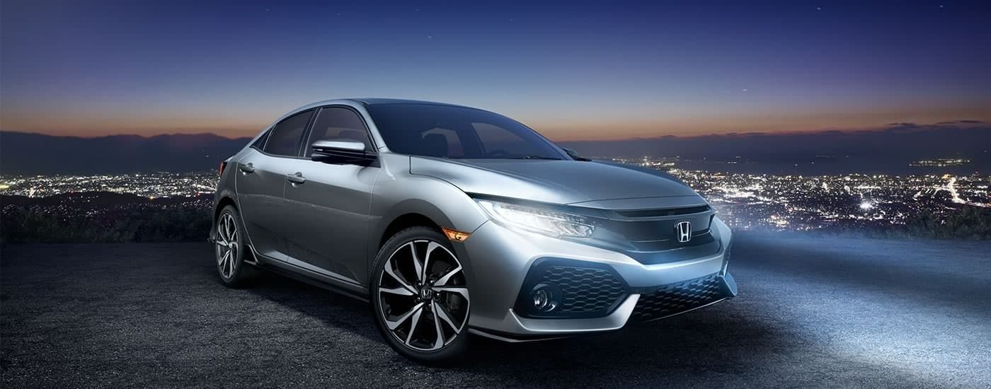 Silver 2017 Honda Civic parked on a hill.