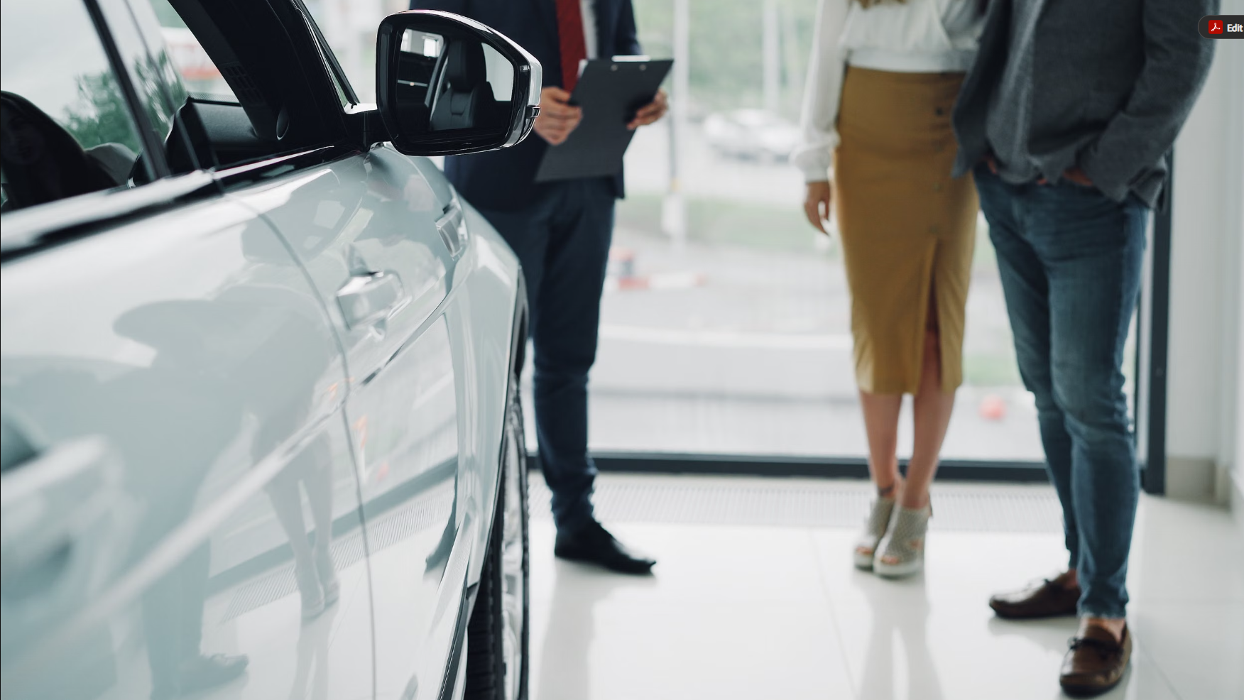 BMW client advisor reviewing vehicle pricing with a customer in the Akron showroom