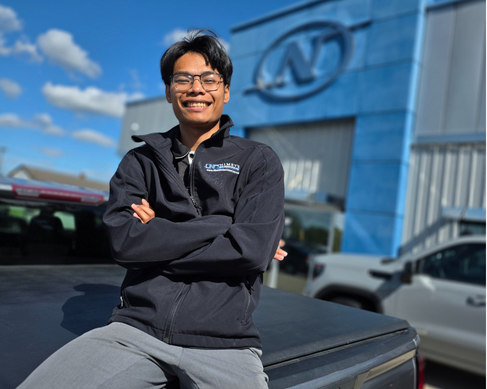 Win, a current New Generation Cars salesperson outside the Utica dealership