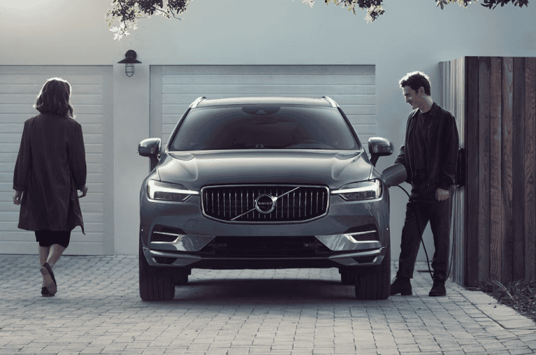 Man and woman approaching an SUV