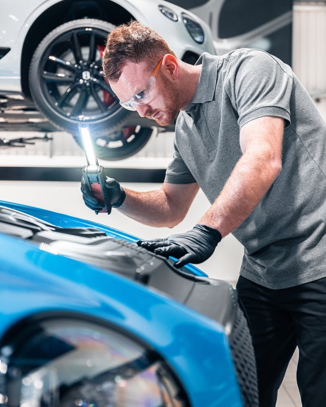Certified technician running a Bentley multipoint diagnostic inspection at Bentley Jacksonville on Bentley Road