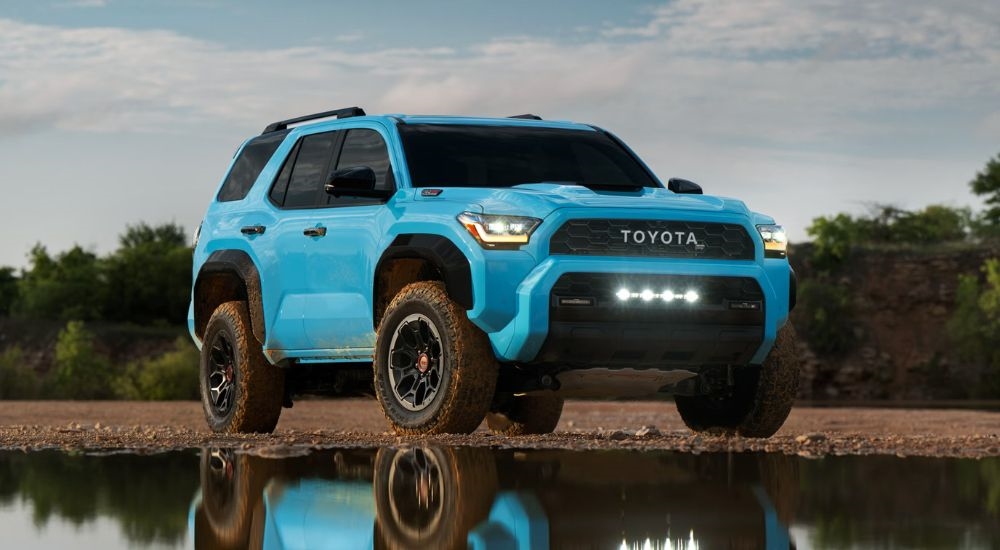 A blue 2026 Toyota 4Runner TRD Pro parked by water.
