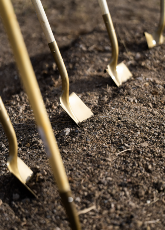 Golden ceremonial shovels used during the Genesis of Denver North groundbreaking ceremony in Broomfield