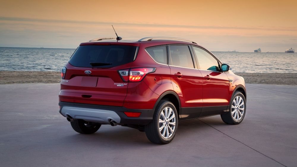 Open cargo area of a Ford Escape showing space for a stroller and everyday gear